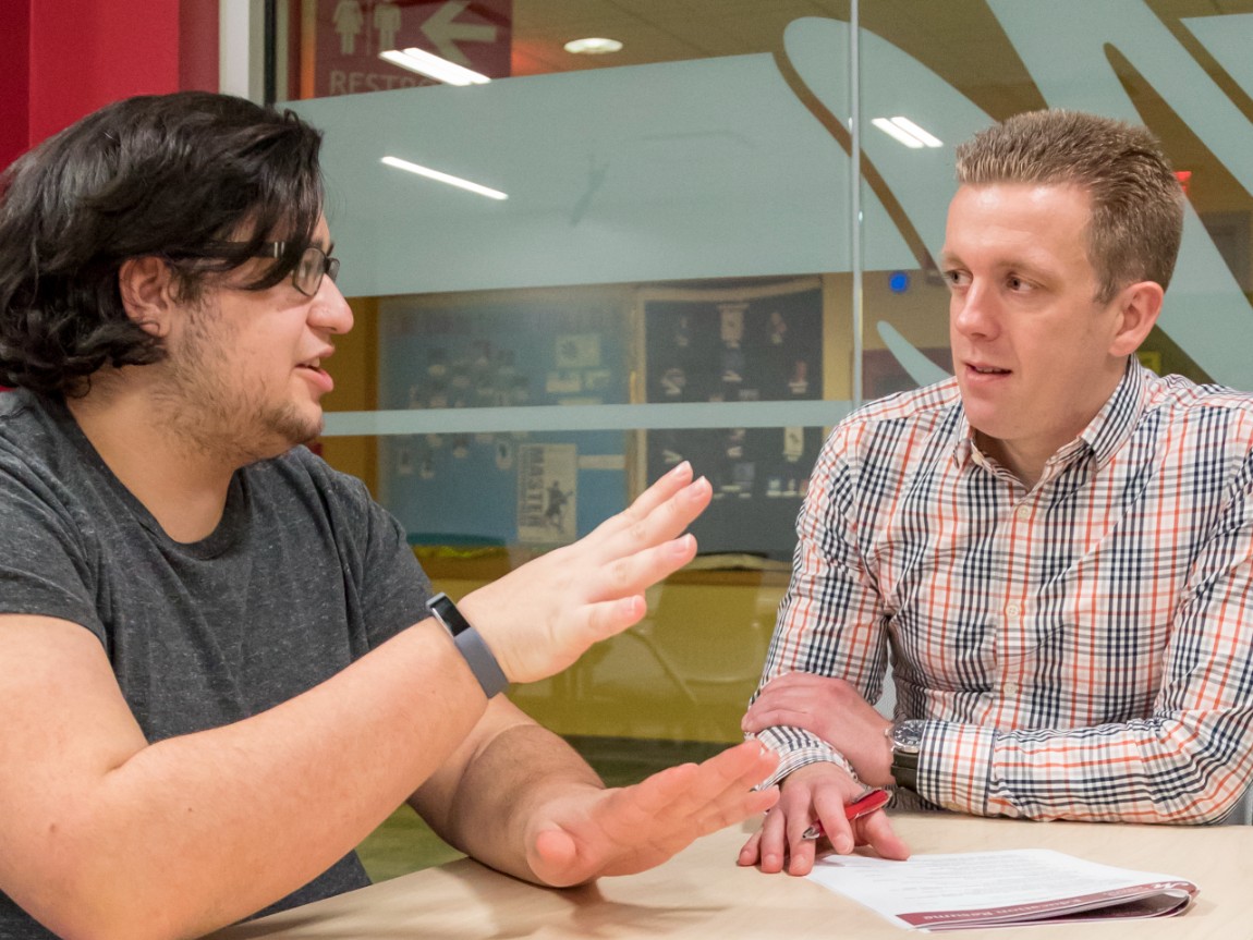 Ryan Smolko helps a students navigate post-graduation opportunities at the Career Center.